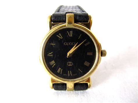 old gucci watch black gold no model number|Gucci gold watch ladies.